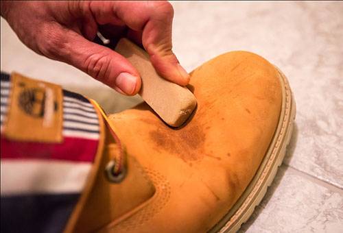 Cleaning a nubuck boot with an eraser