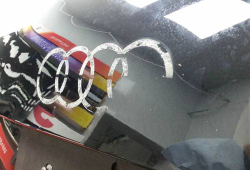 Removing adhesive tape from a car