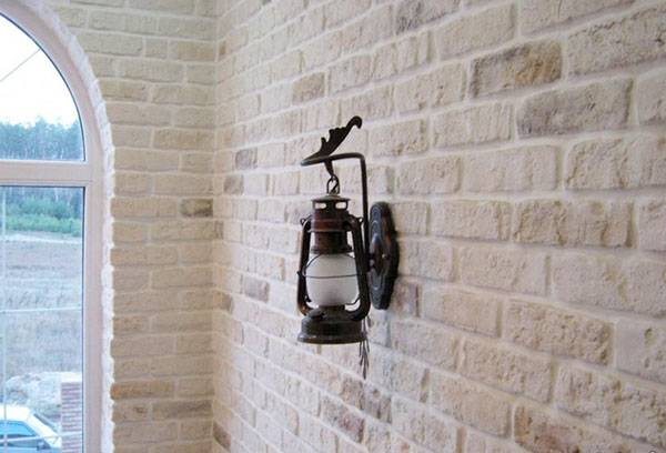 Plaster tile under a brick in an interior