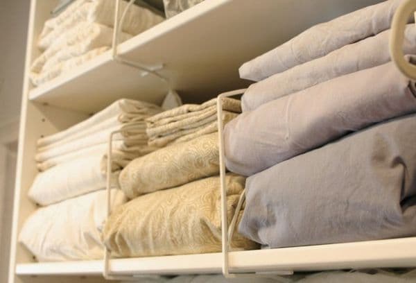 Blankets and pillows on shelves